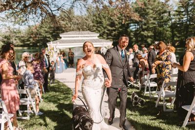 Newlywed couple walking down the aisle